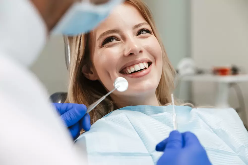 Image Of Young Woman Sitting In Dental Chair